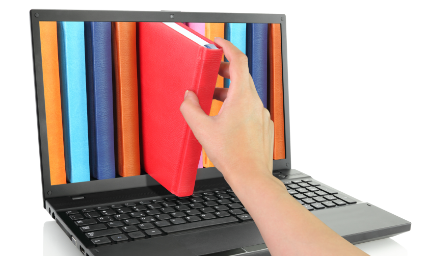Photo illustration of a hand pulling a book out of a laptop screen 